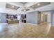 Spacious living room adjacent to kitchen, showcasing an open floor plan with tile flooring at 3131 Bass Boat Way, Kissimmee, FL 34746