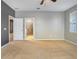 Spacious main bedroom with carpet flooring leading to en-suite bathroom at 3131 Bass Boat Way, Kissimmee, FL 34746