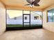 The patio offers a screened-in porch, ceiling fan, and view of the backyard at 3131 Bass Boat Way, Kissimmee, FL 34746