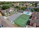 A sunny aerial view showcasing the community pool, playground, and tennis court at 3161 Britannia Blvd # A, Kissimmee, FL 34747