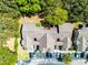 A sunny aerial view of the buildings showcasing the parking and green spaces at 3161 Britannia Blvd # A, Kissimmee, FL 34747