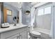 Charming bathroom featuring a tub, shower, and vanity with elegant fixtures at 3161 Britannia Blvd # A, Kissimmee, FL 34747