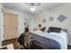 Comfortable bedroom with decorative wall art and a view of the en suite bathroom at 3161 Britannia Blvd # A, Kissimmee, FL 34747