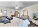 Bright bedroom with a ceiling fan, a decorative mirror, and a view of the bathroom at 3161 Britannia Blvd # A, Kissimmee, FL 34747