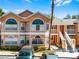 Charming two-story condo with unique architectural details and well-maintained landscaping at 3161 Britannia Blvd # A, Kissimmee, FL 34747