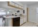 Well-lit kitchen with a view into the dining area, featuring a convenient breakfast bar at 3161 Britannia Blvd # A, Kissimmee, FL 34747