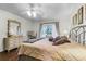 Relaxing main bedroom with ceiling fan and sliding glass doors to the patio at 3161 Britannia Blvd # A, Kissimmee, FL 34747