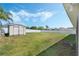 This backyard features a spacious lawn and a storage shed at 3263 Lorimar Ln, St Cloud, FL 34772