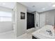 Bright bathroom featuring dual sinks, a separate toilet room, and a glass-enclosed shower at 3263 Lorimar Ln, St Cloud, FL 34772