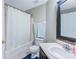 Bathroom features a shower and a large mirror above the sink at 3263 Lorimar Ln, St Cloud, FL 34772