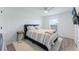 This bedroom has an accent wall, plush carpet, and natural lighting at 3263 Lorimar Ln, St Cloud, FL 34772