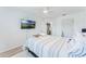 This bedroom has an accent wall, light floors, and natural lighting at 3263 Lorimar Ln, St Cloud, FL 34772