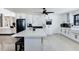 Bright kitchen featuring white cabinetry, a large island with bar seating, and an open layout at 3263 Lorimar Ln, St Cloud, FL 34772
