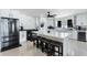 Modern kitchen featuring white cabinetry, stainless steel appliances, and a center island with seating at 3263 Lorimar Ln, St Cloud, FL 34772