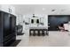 Spacious kitchen features white cabinets, island with seating, and stainless steel appliances at 3263 Lorimar Ln, St Cloud, FL 34772