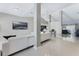Open living area features tile flooring, neutral paint, and a view of the kitchen at 3263 Lorimar Ln, St Cloud, FL 34772