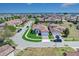 This aerial view captures a home in a meticulously planned community with sidewalks and well-kept landscaping at 362 Villa Sorrento Cir, Haines City, FL 33844