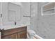 Modern bathroom features updated vanity, toilet, and walk-in shower with stylish tile at 362 Villa Sorrento Cir, Haines City, FL 33844