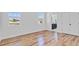 Bright bedroom featuring wood-look floors, white walls and two windows that provide natural light at 362 Villa Sorrento Cir, Haines City, FL 33844