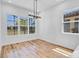 Bright dining room featuring multiple windows and wood-look flooring at 362 Villa Sorrento Cir, Haines City, FL 33844