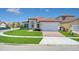 Charming single-story home featuring a brick driveway, manicured lawn, and a classic Mediterranean-style tiled roof at 362 Villa Sorrento Cir, Haines City, FL 33844