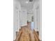 Hallway showcases wood flooring and provides access to multiple rooms within the home at 362 Villa Sorrento Cir, Haines City, FL 33844