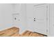 Well-lit laundry room with vinyl flooring and wire shelving is ready for your washer and dryer at 362 Villa Sorrento Cir, Haines City, FL 33844