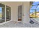 Access to the pool bath with tile flooring and glass sliding doors at 362 Villa Sorrento Cir, Haines City, FL 33844