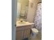 Standard bathroom featuring a toilet and sink with a shower and butterfly themed curtain at 366 Jaybee Ave, Davenport, FL 33897