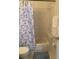 Standard bathroom featuring a toilet and sink with a shower and butterfly themed curtain at 366 Jaybee Ave, Davenport, FL 33897