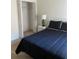 Bedroom with neutral carpet, a queen bed, adjacent to the closet and window at 366 Jaybee Ave, Davenport, FL 33897