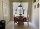 Bright breakfast nook featuring a round table with four chairs near a large window and closet at 366 Jaybee Ave, Davenport, FL 33897