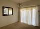 Bright dining room with carpet, a chandelier, curtains and a wall mirror at 366 Jaybee Ave, Davenport, FL 33897