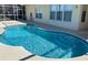 Inviting swimming pool with crystal clear water and a spacious deck area at 366 Jaybee Ave, Davenport, FL 33897