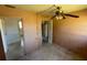 Bedroom featuring neutral walls and floors and a ceiling fan at 4226 Lake Richmond Dr, Orlando, FL 32811