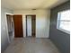Bedroom with neutral gray walls and carpeted floors and a window for natural light at 4226 Lake Richmond Dr, Orlando, FL 32811
