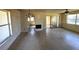 Spacious living room featuring a fireplace, sliding glass doors to the outside, and lots of natural light at 4226 Lake Richmond Dr, Orlando, FL 32811