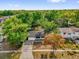 Aerial view of the home and surrounding trees at 4410 Rossmore Dr, Orlando, FL 32810