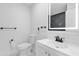 Updated bathroom featuring illuminated mirror, sleek vanity, and modern fixtures at 4410 Rossmore Dr, Orlando, FL 32810