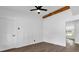 Bright bedroom with ceiling fan, wood-look flooring, and paneled accent wall at 4410 Rossmore Dr, Orlando, FL 32810