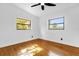 Cozy bedroom with hardwood floors, freshly painted walls, and plenty of natural light at 4410 Rossmore Dr, Orlando, FL 32810