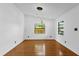 Elegant dining room with hardwood floors, recessed lighting, and modern chandelier at 4410 Rossmore Dr, Orlando, FL 32810