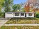 Charming single-story home featuring a well-maintained yard and an attached one-car garage at 4410 Rossmore Dr, Orlando, FL 32810