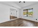 Open-concept living room featuring new flooring, fresh paint, and ample natural light at 4410 Rossmore Dr, Orlando, FL 32810