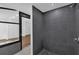 Stylish shower with dark gray tile and modern fixtures at 4410 Rossmore Dr, Orlando, FL 32810