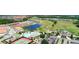 Aerial view of a golf community with tennis courts, a pool, and a clubhouse at 4623 Wandsworth Way, Davenport, FL 33837