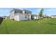 Spacious backyard with lush green grass, offering ample space for outdoor activities and relaxation at 4623 Wandsworth Way, Davenport, FL 33837