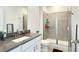 Modern bathroom with a glass-enclosed shower, vanity, and neutral color palette, ensuring a clean and stylish look at 4623 Wandsworth Way, Davenport, FL 33837