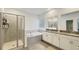 Bathroom featuring a separate shower, soaking tub, and double vanity sinks at 4623 Wandsworth Way, Davenport, FL 33837