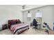 Comfortable bedroom with ample natural light, a ceiling fan, and dedicated workspace, creating a relaxing atmosphere at 4623 Wandsworth Way, Davenport, FL 33837